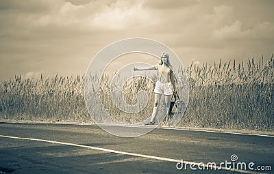 Hitchhiking girl votes on road,with retro effect Stock Photo