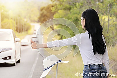 Hitchhiking tourism concept. Traveling alone, When there is a problem, need help Stock Photo