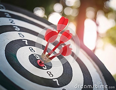Hitting a target and achieving goals featuring elements like a bullseye, arrows, and targets representing precision, focus, and Stock Photo