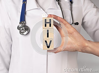 HIV acronym, word in doctor hands on cube blocks Stock Photo