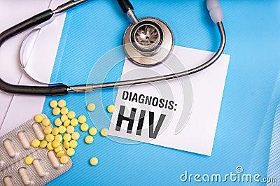 HIV word written on medical blue folder with patient files Stock Photo