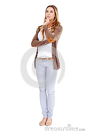 Hmmm...what should we do with this copyspace. A young woman in casual wear looking thoughtful - isolated. Stock Photo