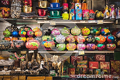 Ho Chi Minh City: abundance of souvenirs caskets, statuettes, cups, etc on shelves in a shop in Ben Thanh Market Editorial Stock Photo