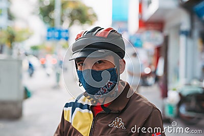 HO CHI MINH CITY,VIETNAM - DEC 10: People wearing mouth mask in Ho Chi Minh City Saigon, Vietnam Editorial Stock Photo