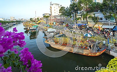 Flowers boat at flower market along canal wharf Editorial Stock Photo