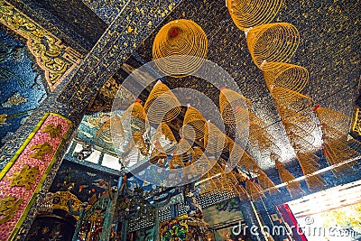 Inside the main hall of Phu Chau temple is elaborately decorated with many fragments of crockery, with a age of 3 centuries and is Editorial Stock Photo