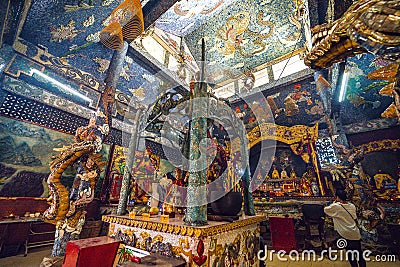 Inside the main hall of Phu Chau temple is elaborately decorated with many fragments of crockery, with a age of 3 centuries and is Editorial Stock Photo