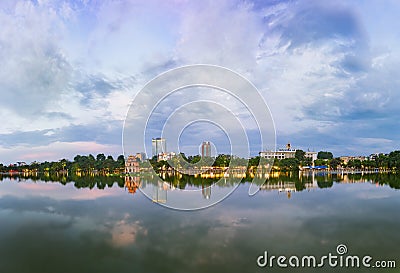 Hoan Kiem lake panorama view at sunset period with ancient Turtle Tower and Hanoi post office. Hoan Kiem lake or Sword lake or Ho Stock Photo