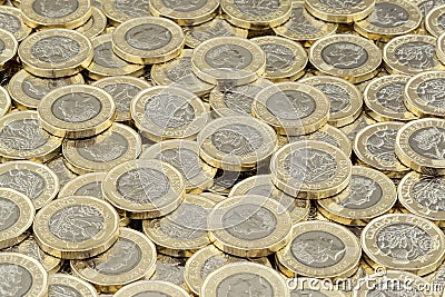 Hoard of money. Scattered pile of British pound coins. Editorial Stock Photo