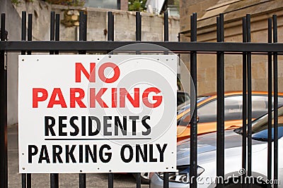 No parking sign attached to a fence Editorial Stock Photo