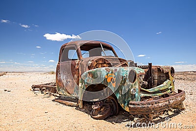 Close up of an old, rusty car wreck in the Namibian desert Editorial Stock Photo