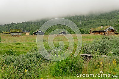 A Hobbit like village in high mountains in Norway. Houses with moss on their roof Stock Photo