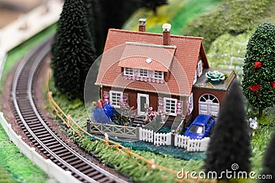 Hobby model of a rural brown house at the railway. Stock Photo