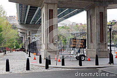 Hoboken, NJ/USA - May 4th 2020 : Sign for Coronavirus drive through testing site under the viaduct Editorial Stock Photo