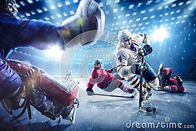 Hockey players shoots the puck and attacks Stock Photo