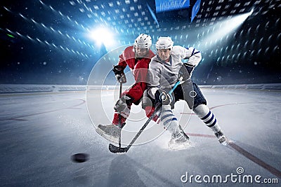 Hockey players shoots the puck and attacks Stock Photo