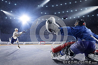 Hockey players shoots the puck and attacks Stock Photo