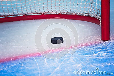 Hockey puck crossing goal line Stock Photo