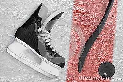Hockey stick, skates, puck and red line Stock Photo