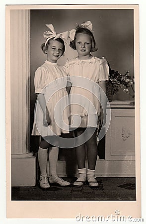 A vintage photo of the young girls - the first holy communion, circa 1945 Editorial Stock Photo
