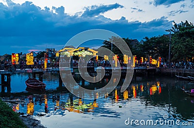 Hoi An city lights and a pedestrian bridge over the Thu Bon river in Vietnam Stock Photo