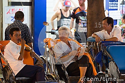 Hoi An, Vietnam - Jun 20, 2015: Cyclo drivers waiting for passenger Editorial Stock Photo