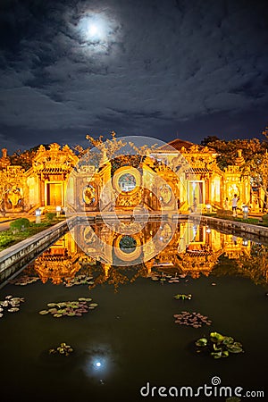 Hoi An, Vietnam. Ba Mu temple pond by full moon, in the historic city center Stock Photo