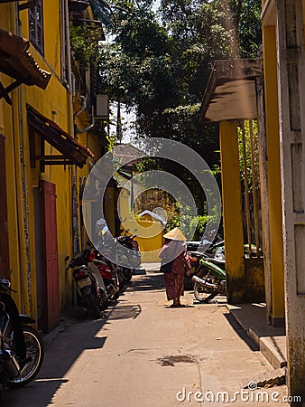 HOIAN, VIETNAM, SEPTEMBER, 04 2017: Matocycles parket in a path with old houses,in Hoi An ancient town, UNESCO world Editorial Stock Photo