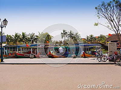 HOIAN, VIETNAM, SEPTEMBER, 04 2017: Unidentified people biking and walking in the streets in Hoi An ancient town, UNESCO Editorial Stock Photo