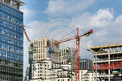 Hoisting cranes and building of new apartments Stock Photo