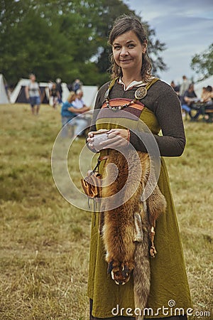 Hojbjerg, Denmark, August, 2022: Beautiful viking woman with fox skin Editorial Stock Photo