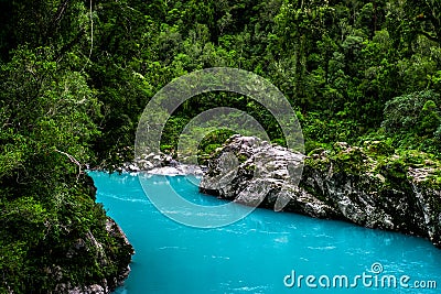 Hokitika Gorge, West Coast, New Zealand. Beautiful nature with blueturquoise color water and wooden swing bridge Stock Photo
