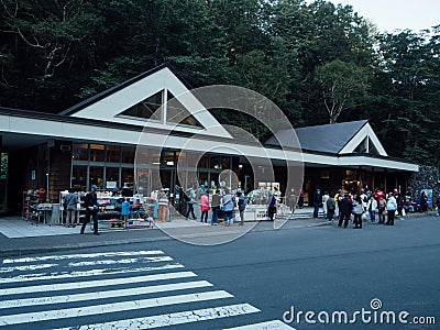 Group of tourists shopping at souvenir shop at RyuSei-No-Taki Ryu Sei waterfall, famous waterfalls near the Daisetsu National Pa Editorial Stock Photo