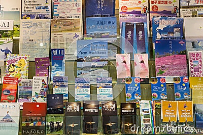 Hokkaido Travel Brochures on display at Hokkaido Tourist Information Center in Chitose Internatioanl Airport Editorial Stock Photo