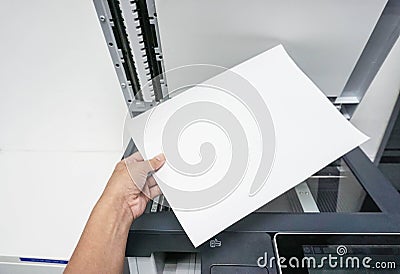 Hold paper for printing document Stock Photo