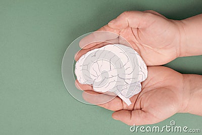 Holding a brain in the hands, Parkinson disease, Alzheimer awardness, mental disorder dementia Stock Photo