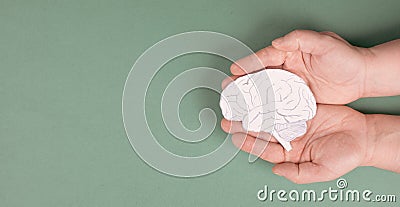 Holding a brain in the hands, Parkinson disease, Alzheimer awardness, mental disorder dementia Stock Photo