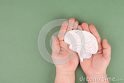 Holding a brain in the hands, Parkinson disease, Alzheimer awardness, mental disorder dementia Stock Photo