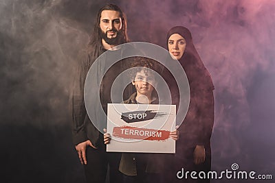 Holding card with stop terrorism lettering Stock Photo