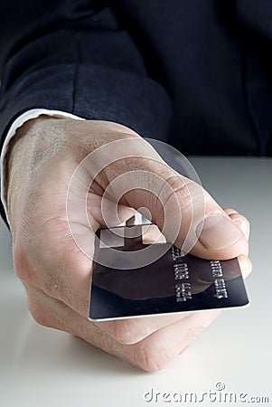 Holding a credit card Stock Photo