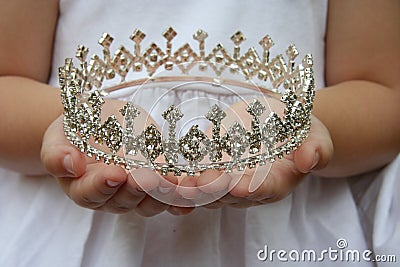 Holding crown Stock Photo
