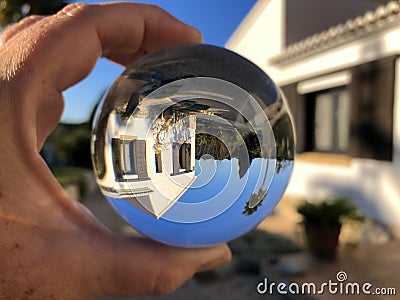 Creative concept, crystal ball and dream home Stock Photo