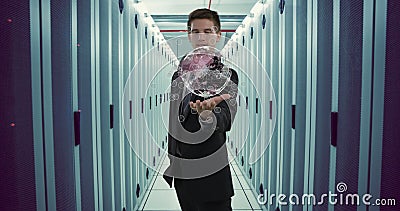 Holding digital globe, businessman in data center visualizing global network connections Stock Photo