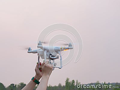 Holding Drone at sunset Stock Photo