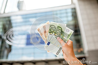 Holding euro banknotes Stock Photo