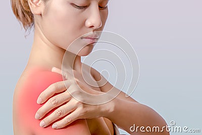 Holding hand on right shoulder Stock Photo