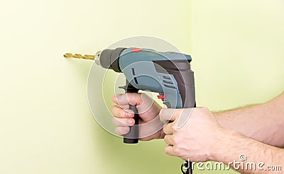 Holding in hands Electric drills Stock Photo