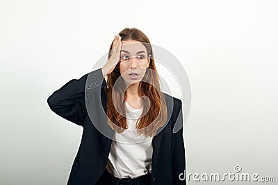 Holding her head with hand can not believe shocked and despair being in panic Stock Photo