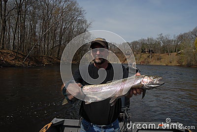 Holding large steelhead Editorial Stock Photo