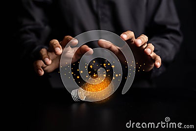à¹‡Holding light bulbs, ideas of new ideas beautiful creative and communicate the new inventions with innovative technology and Stock Photo